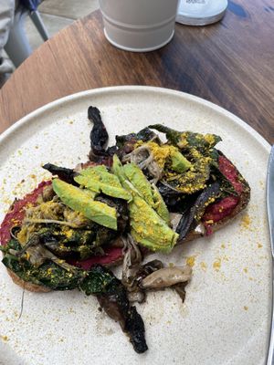 Mushrooms on sourdough - vegan option - forgot to take photo before I cut it in half!  at Combi in Byron Bay