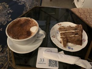 Coconut chai latte & vegan gf toffee, date & walnut cake  at Chapter One in Manchester