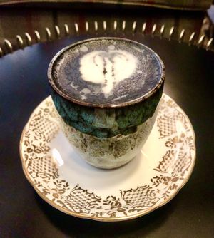 Charcoal oat latte  at Chapter One in Manchester