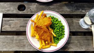 Tofish fillets with chips and peas at The Monument in Canterbury