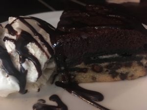 Triple layer brownie (brownie, oreos, cookie dough) with vanilla ice cream at The Monument in Canterbury