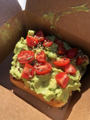 Pile of avocado on 1 1/4” thick slice sourdough   at Skull & Cakebones in Dripping Springs