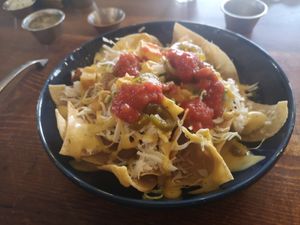 This was bigger than it looks. 'chorizo' cheese sauce, shredded cheese, salsa. Really tasty! at Esparza's Tacos & Coffee in Chatan