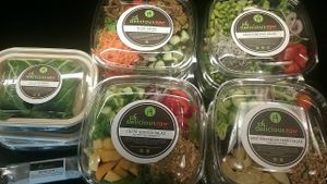 Vegan salads and their B.L.A.T.E wrap with tempeh bacon and eggplant. at Delicious Raw Kitchen and Juice Bar in Naples