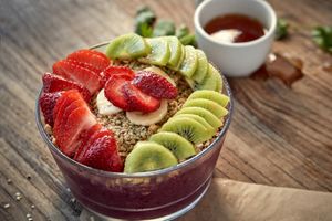 Super Bowl 
Acai (premium grade a unsweetened) blended with kale, banana, blueberry, raspberry, strawberry, matcha, hemp oil, almond milk and dates.   Topped with strawberry, kiwi, at Delicious Raw Kitchen and Juice Bar in Naples