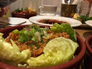 Kisir - Tomato and red pepper flavoured brown bulgur salad with fresh vegetables, lemon and olive oil - ca. 3 Euros at Dobrumba in Budapest