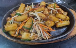 Sizzling stir fried rice noodle rolls in soy sauce at Woka Woka in Sunnybank