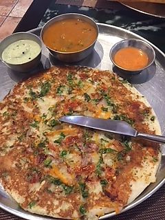 Mixed Vegetable pancake. Comes with a coconut sauce, lentil soup, and a garlic sauce at Dosa World in Hicksville