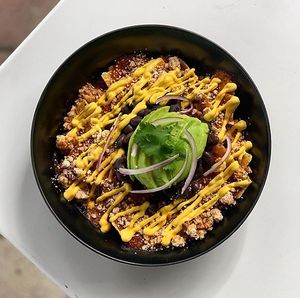 CHILAQUILES WITH EXTRA CASHEW CHEESE AND AVOCADO at Chula in San Jose Del Cabo