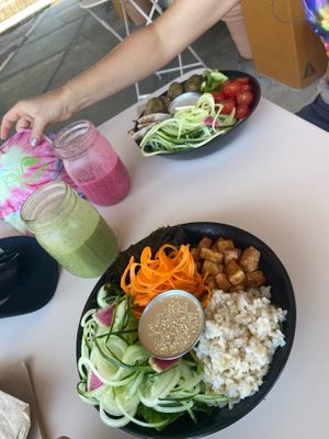 The Asian bowl in the foreground, the Mediterranean bowl in the background. 
A pink lady smoothie and I don’t remember the green one.  at Chula in San Jose Del Cabo
