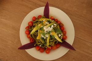 Zuchini noodles with avocado , grape tomatoes and pesto sauce. at Vida Lotus in Limon Campana Capira