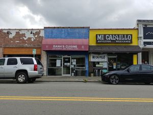 Front overview: street parking with a small lot across the street at Bahn's Cuisine in Durham