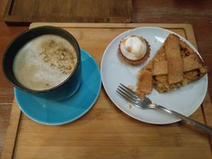 green tea with oat milk, mini lemon pie, apple pie at La Colectiva Cafe in Madrid