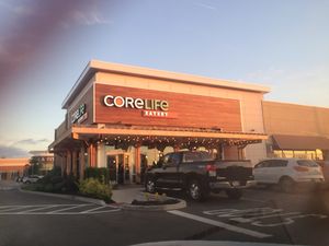 outside in front of LA Fittness in middle of parking lot  at CoreLife Eatery in Henrietta