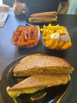 Front: Cheese and chorizo toastie
Middle: Sweet potato fries & Nuggets with French fries
Back: Cheese, Ham, Chorizo, back toastie at Vegana By Tentúgal in Porto