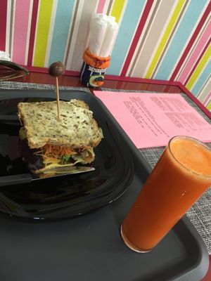 Traditional Chorizo/cheese sandwich made with seitan chorizo ? Freshly juiced orange/carrot ginger juice at Vegana By Tentúgal in Porto