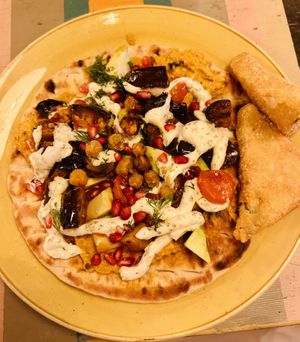 Aubergine & chickpea flatbread with hash browns  at Lounges - Brunello in Weston-super-mare