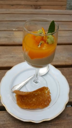Layered tangerine kanten with vanilla mousse served with a lace biscuit.    at Simone's Kitchen in Antwerpen