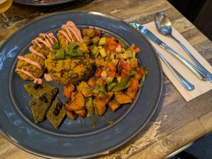 Falafel main with mushroom rice, spinach fritatta, roasted pumpkin, marinated olives and salad at Simone's Kitchen in Antwerpen