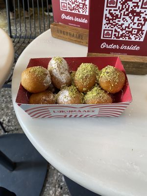 Icing sugar balls (left) and maple syrup balls (right)  at Lukumades in Athens