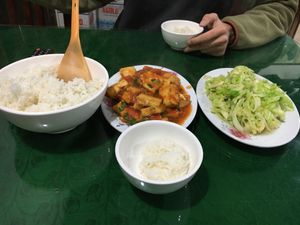 Big rice bowl (40VND), Tofu in tomato sauce (30VND), cabbage (30VND)  at Nha Hang Quang Dung in Ha Giang