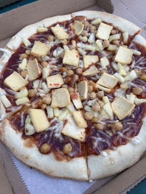 Bbq sauce base, vegan cheese, chickpeas, pineapple, and tofu  at Nags Head Pizza Company in Nags Head