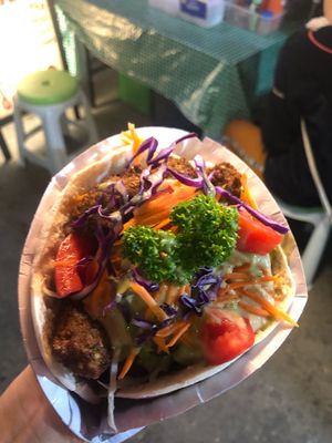 100 B, green tahini dressing, hummus and so many falafels in this pita!  at Queen Falafel in Pai