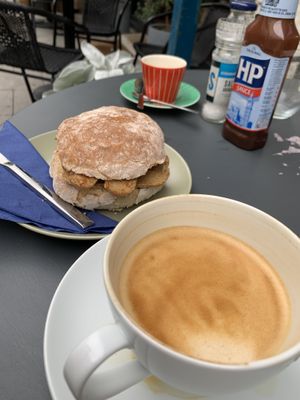 Breakfast rustic roll with vegan sausages and oat latte  at The Fuchsia Caffe in Tenby