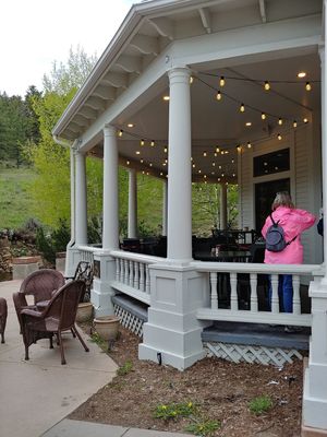 Outside seating near creek at Mama Rose in Estes Park