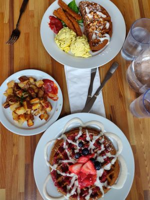 Berries waffles, pumpkin pie waffle, tofu scramble, vegan bacon, and hashbrowns at Off The Griddle - Southeast in Portland