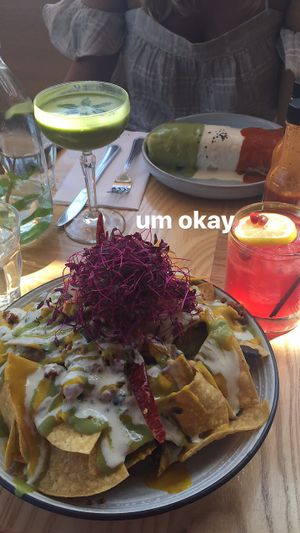 Nachos, burrito, jalapeño pomegranate cocktail, and matcha coconut cocktail  at Jajaja Mexicana - Lower East Side in New York City