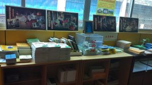 Buddhist literature and photos of giving food to the poor at PuTiShu Banyan Tree in Zhangzhou