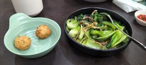 3 sotong balls eaten by us and a bowl of seasonal vegetables. at Rice House 谷王栈( 粥大王) in Central Singapore