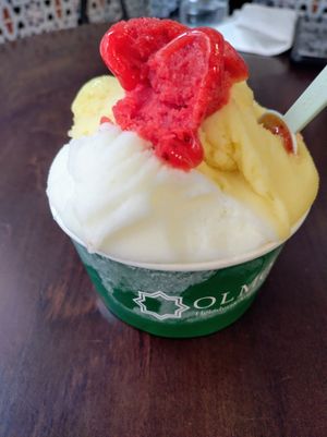 Lemon, passionfruit and raspberry sorbet at OLMO Heladería Artesanal in Sevilla