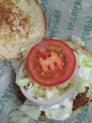 A sad single onion ring in a Cézár burger :( at Epoch Vegan Burger in Budapest