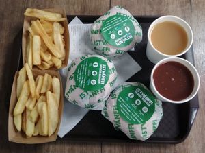 Burgers, fries and fruit juice, as served in October 2020. at Epoch Vegan Burger in Budapest