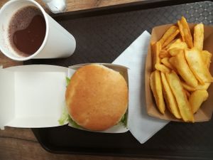 Large menu with double burger, fries and juice at Epoch Vegan Burger in Budapest