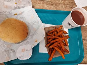 Epoch menu with sweet potato fries and cherry juice at Epoch Vegan Burger in Budapest