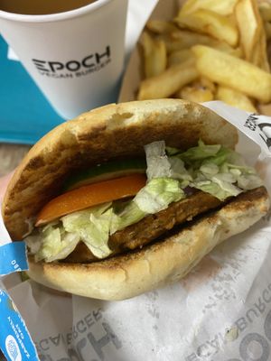 Cezar burger with EPOCH patty and peach juice  at Epoch Vegan Burger in Budapest