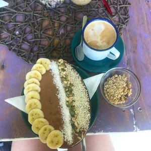Chocolate smoothie bowl with coconut milk and a coconut milk latte at Aloha Coffee Gallery in Mirissa