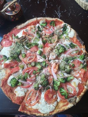 Pizza with tomato, aspergus, mushrooms and onions at NaturAle Cusco in Cusco