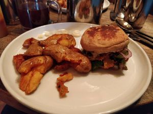 English Muffin sandwich with side potatoes.  at The Gold Leaf in Fort Collins