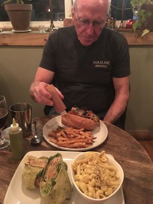 Lion’s Mane Buffalo Wrap with Mac & Shew; Seitan Philly with fries.  House-made ketchup & hot sauce. at The Gold Leaf in Fort Collins