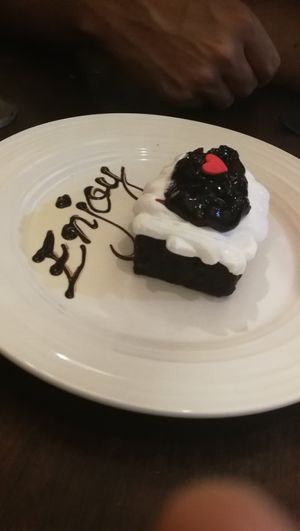 Chocolate cake with whipped soy cream and blueberry jam at Sushi Kitchen in Penang