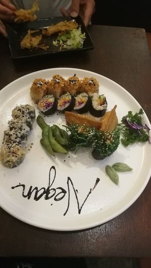 Sushi set. Half eaten deepfried mushroom dish on the back at Sushi Kitchen in Penang