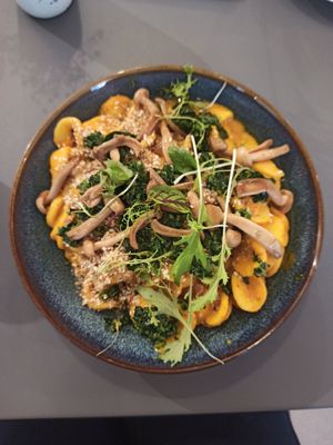 Creamy pumpkin pasta with asian mushrooms, miso sauce and parsley at Wilk Syty in Wroclaw