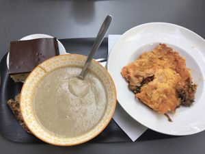 From left to right : coconut cake with chocolate glaze, eggplant cold soup, lasagna  at Happy Feel in Lyon