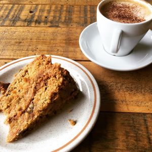 VEGAN - oatly flat white & carrot cake at The Organic Bee Cafe in Wadebridge