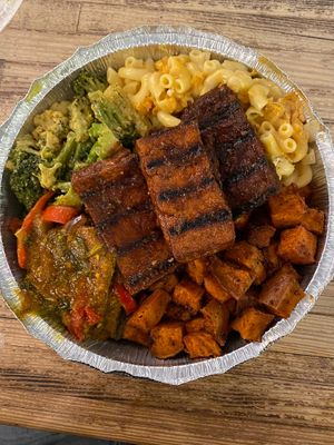 Medium plate: jerk tofu, mac&cheese, curried veggies, veggie fish curry and sweet potatoes!  at Ninth Square Market Caribbean Style in New Haven