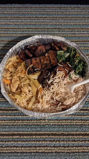 Medium combo with jerk tofu, greens, rice and peas, plantains at Ninth Square Market Caribbean Style in New Haven